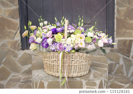 a basket of flowers on the steps in front of the front door a basket of flowers on the steps in front of the front door 115128181