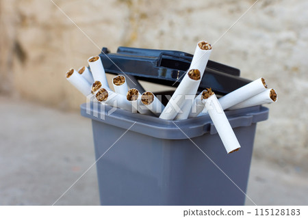 cigarettes in the trash can. to give up smoking 115128183