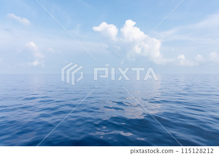 sun glare on the surface of blue sea water 115128212