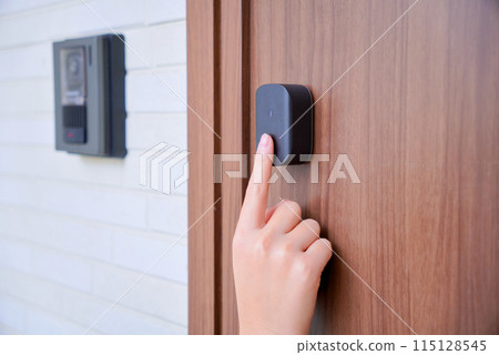 Child unlocking front door with fingerprint Child unlocking front door with fingerprint 115128545