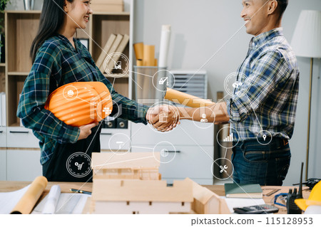 Engineer desk with object paper and tablet with blurry engineer teamwork hardworking to consults about their building Engineer desk with object paper and tablet with blurry engineer teamwork hardworking to consults about their building 115128953