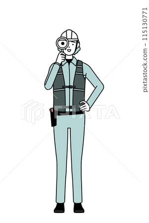 Senior female engineer in helmet and work clothes looking through a magnifying glass 115130771
