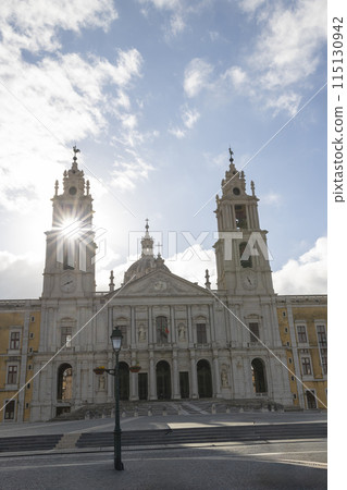 National Palace of Mafra, Portugal - sunny day - the sun is shining on the large tower National Palace of Mafra, Portugal - sunny day - the sun is shining on the large tower 115130942