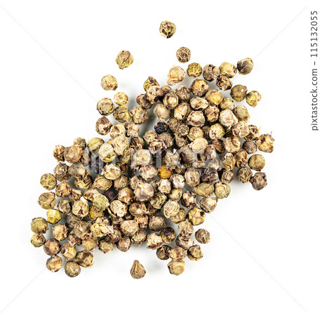 fragrant spice green pepper is scattered on a white isolated background. Top view fragrant spice green pepper is scattered on a white isolated background. Top view 115132055