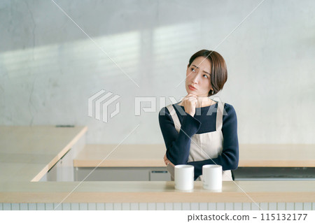 Women staff working at a cafe Women staff working at a cafe 115132177