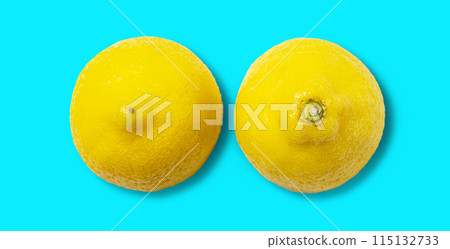 two half fresh lemon pattern on blue background. Top view and copy space. two half fresh lemon pattern on blue background. Top view and copy space. 115132733