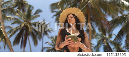 Relaxation During Luxury Vacation of Bikini Beach Woman at Palm Trees 115132895