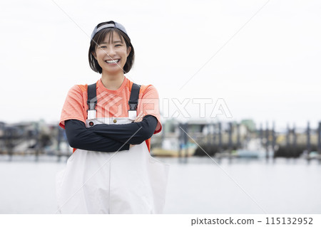 Young woman working at the fishing port Young woman working at the fishing port 115132952
