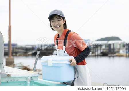Woman working at fishing port 115132994