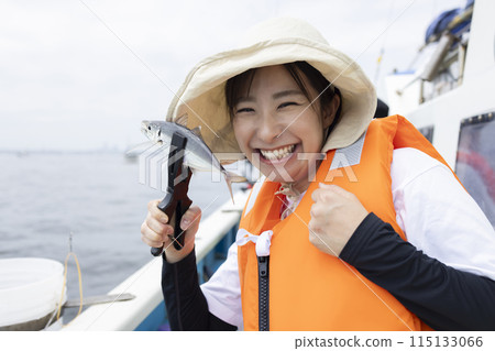 Cute woman enjoying fishing 115133066