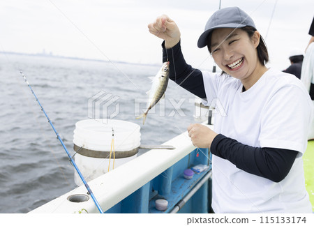Cute woman enjoying fishing Cute woman enjoying fishing 115133174