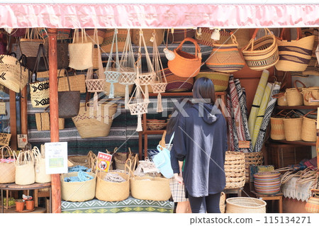 A female customer looking at Asian-style bags 115134271