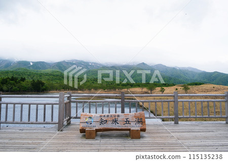 View from the observation deck at Lake Shiretoko, with the Shiretoko mountain range covered in clouds View from the observation deck at Lake Shiretoko, with the Shiretoko mountain range covered in clouds 115135238