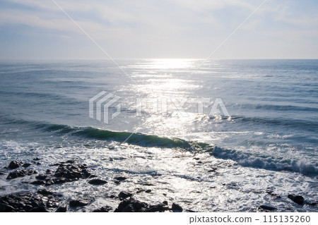 A view of the sea and sky shining in the sun, the Sea of Okhotsk as seen from Shiretoko Shari Town 115135260
