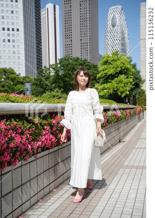 A young woman walking in an office town 115136232