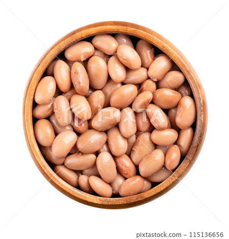 Borlotti beans in a wooden bowl. Cooked and canned cranberry beans, a hazelnut-colored variety of the common bean, Phaseolus vulgaris. Vegetarian staple food. Isolated, from above close-up food photo. 115136656