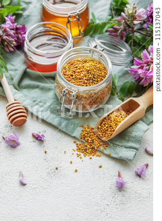 Raw organic bee pollen and honey in jars. Raw organic bee pollen and honey in jars. 115137043