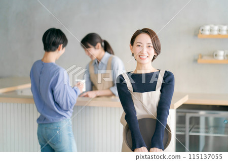 People working in a cafe People working in a cafe 115137055