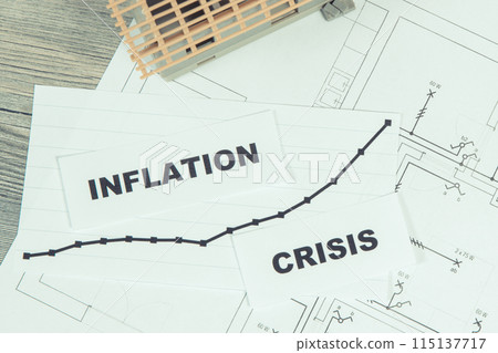 Inscriptions crisis and inflation, small house under construction on electrical diagrams of house Inscriptions crisis and inflation, small house under construction on electrical diagrams of house 115137717