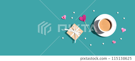 A cup of coffee with a gift box and hearts 115138625