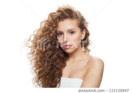 Elegant fashion model with frizzy hair, natural makeup and healthy clean skin posing  115138847