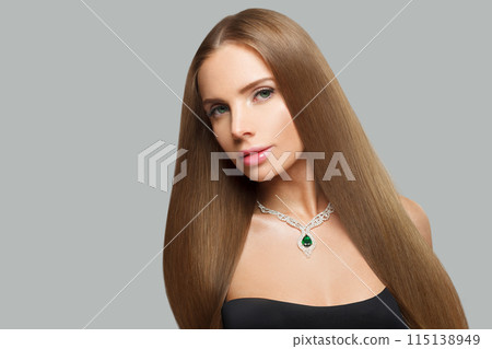 Pretty glamorous woman with brown hair, makeup and gold jewelry closeup fashion beauty portrait Pretty glamorous woman with brown hair, makeup and gold jewelry closeup fashion beauty portrait 115138949