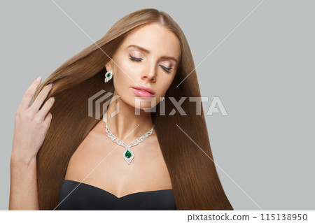 Pretty fashionable jewelry woman fashion model with straight smooth healthy long hair, make-up  115138950