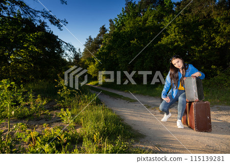 The teenager has returned home to her country after a wonderful vacation trip and is waiting for her family to take her home. The teenager has returned home to her country after a wonderful vacation trip and is waiting for her family to take her home. 115139281