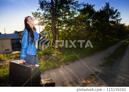 The teenager has returned home to her country after a wonderful vacation trip and is waiting for her family to take her home. 115139282