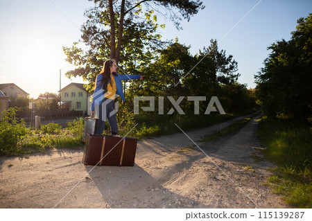The teenager has returned home to her country after a wonderful vacation trip and is waiting for her family to take her home. The teenager has returned home to her country after a wonderful vacation trip and is waiting for her family to take her home. 115139287