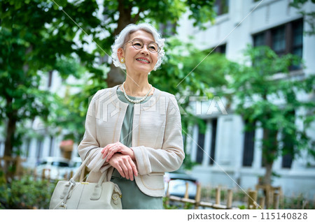 Senior woman with a bag going out Senior woman with a bag going out 115140828