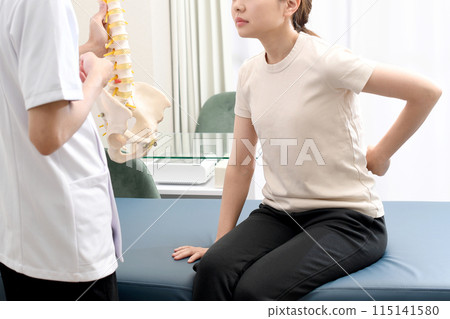 A man in a white coat and a woman receiving counseling 115141580