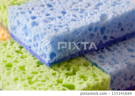 Washing Essentials. Colorful sponges with visible pores for scrubbing. Uses for Home maintenance articles, cleaning product ads. 115141684