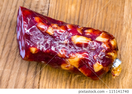 Gourmet salami with a rich, marbled texture, suitable for high-end deli marketing or culinary articles. 115141740