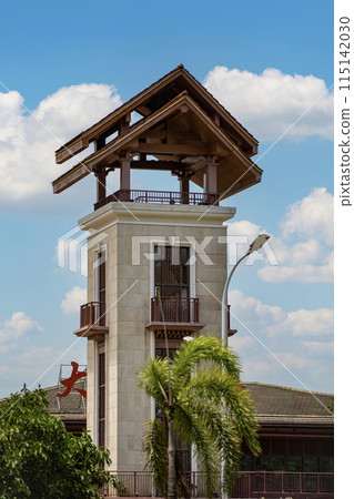 Enjoy the view of a uniquely designed clock tower with a stylish roof that enhances the cityscape 115142030