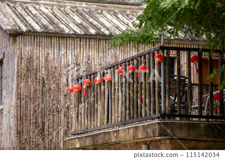 Rustic house with red lanterns, charming balcony, and a mix of traditional and natural design 115142034