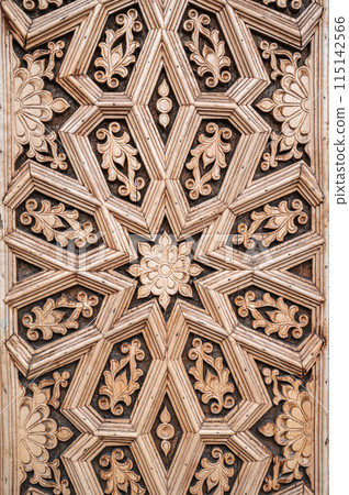 oriental Islamic pattern Uzbek traditional ornament on wooden carved door in Tashkent in Uzbekistan close up oriental Islamic pattern Uzbek traditional ornament on wooden carved door in Tashkent in Uzbekistan close up 115142566