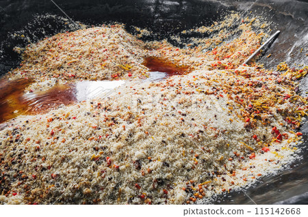 cooked delicious traditional oriental Uzbek pilaf in cauldron. Central Asian Pilaf Center Besh Qozon in Uzbekistan in Tashkent cooked delicious traditional oriental Uzbek pilaf in cauldron. Central Asian Pilaf Center Besh Qozon in Uzbekistan in Tashkent 115142668