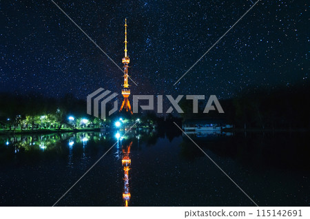 television TV tower illuminated in Tashkent in Uzbekistan with a reflection in water of river on background of a dark blue starry night sky television TV tower illuminated in Tashkent in Uzbekistan with a reflection in water of river on background of a dark blue starry night sky 115142691