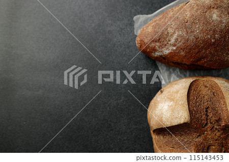 beautiful homemade raisin bread on parchment 115143453