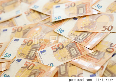 Very big amount of fifty european euro banknotes in huge pile close up 115143756