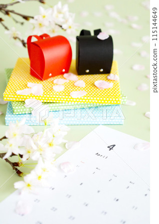 Cherry blossom petals and red school bag April calendar Image of school entrance and new semester Cherry blossom petals and red school bag April calendar Image of school entrance and new semester 115144649