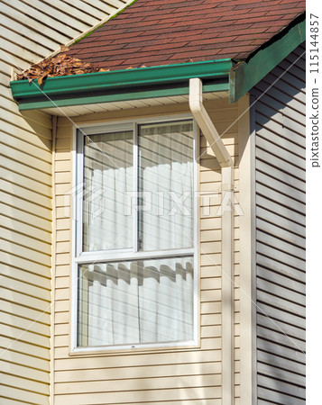Window and roof of residential house submodule on sunny day 115144857