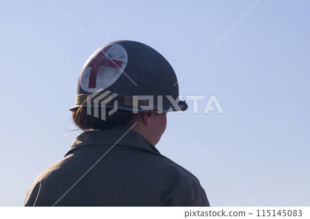 US Army nurse in WWII uniform 115145083