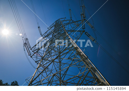 Blue sky and high voltage tower seen from below Blue sky and high voltage tower seen from below 115145894