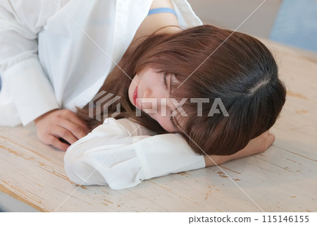 A woman taking a nap - The one she was waiting for never came 115146155