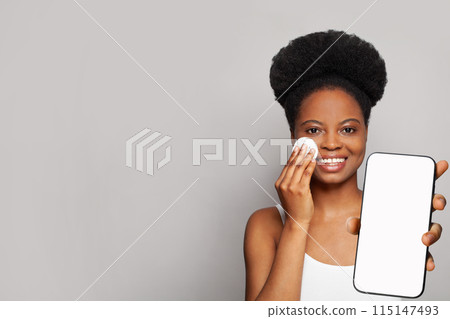 Glamorous healthy woman holding smartphone with white empty blank screen display  115147493