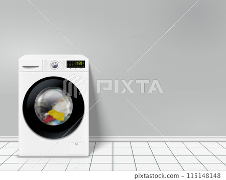 Modern washing machine with color clothes in empty laundry room 115148148