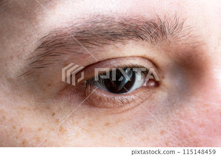 Dark brown human eye close up, view of deep black man eye Dark brown human eye close up, view of deep black man eye 115148459