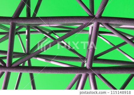 Abstract metal figure on a green background, artistically welded metal pipes, fragment of scaffolding in NYC 115148918